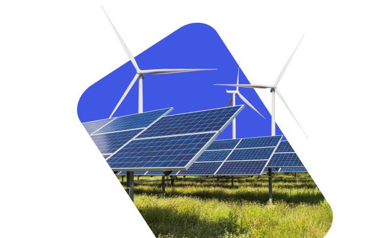 Solar panels stand in a field with wind turbines in the background, set against a bright blue section of the sky.