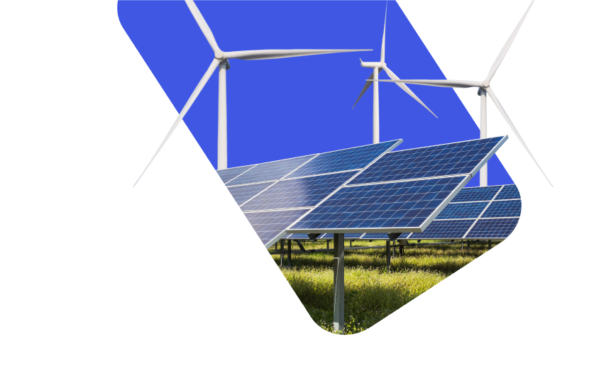 Solar panels stand in a field with wind turbines in the background, set against a bright blue section of the sky.